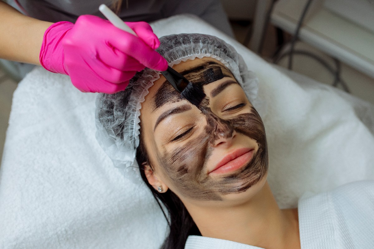 Close Up Of Carbon Peeling Procedure For Middle Aged Woman Face. Laser Pulses Clean Skin. Process Of Photothermolysis, Warming, Laser Carbon Peeling. Facial Skin Rejuvenation, Cosmetology Treatment.