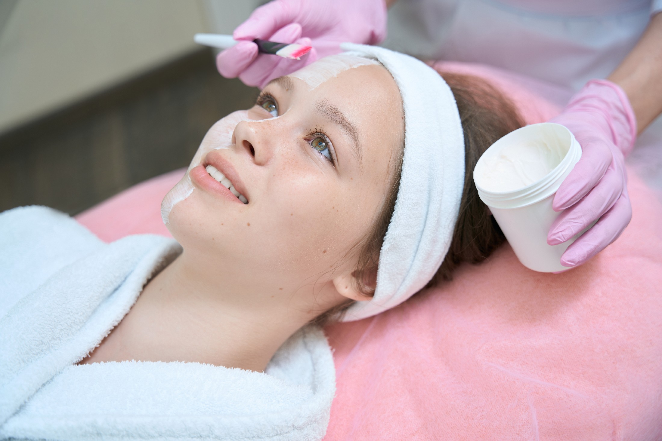 Profile Photo Of Girl Being Applied By Beautician To Face