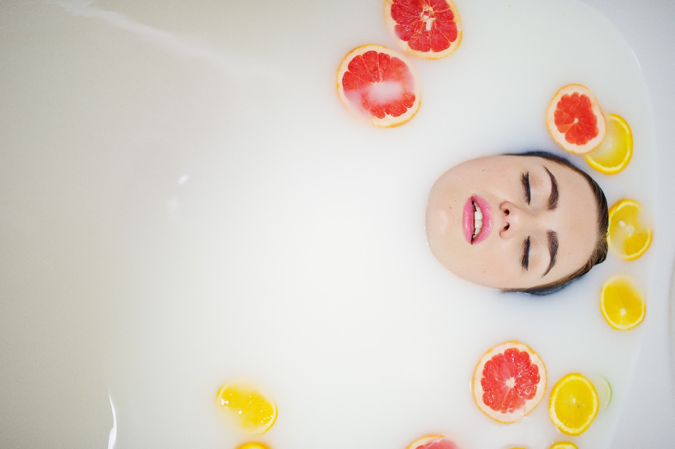 Sexy Brunette Girl At The Bathroom With Milk And Fruits. Youth B