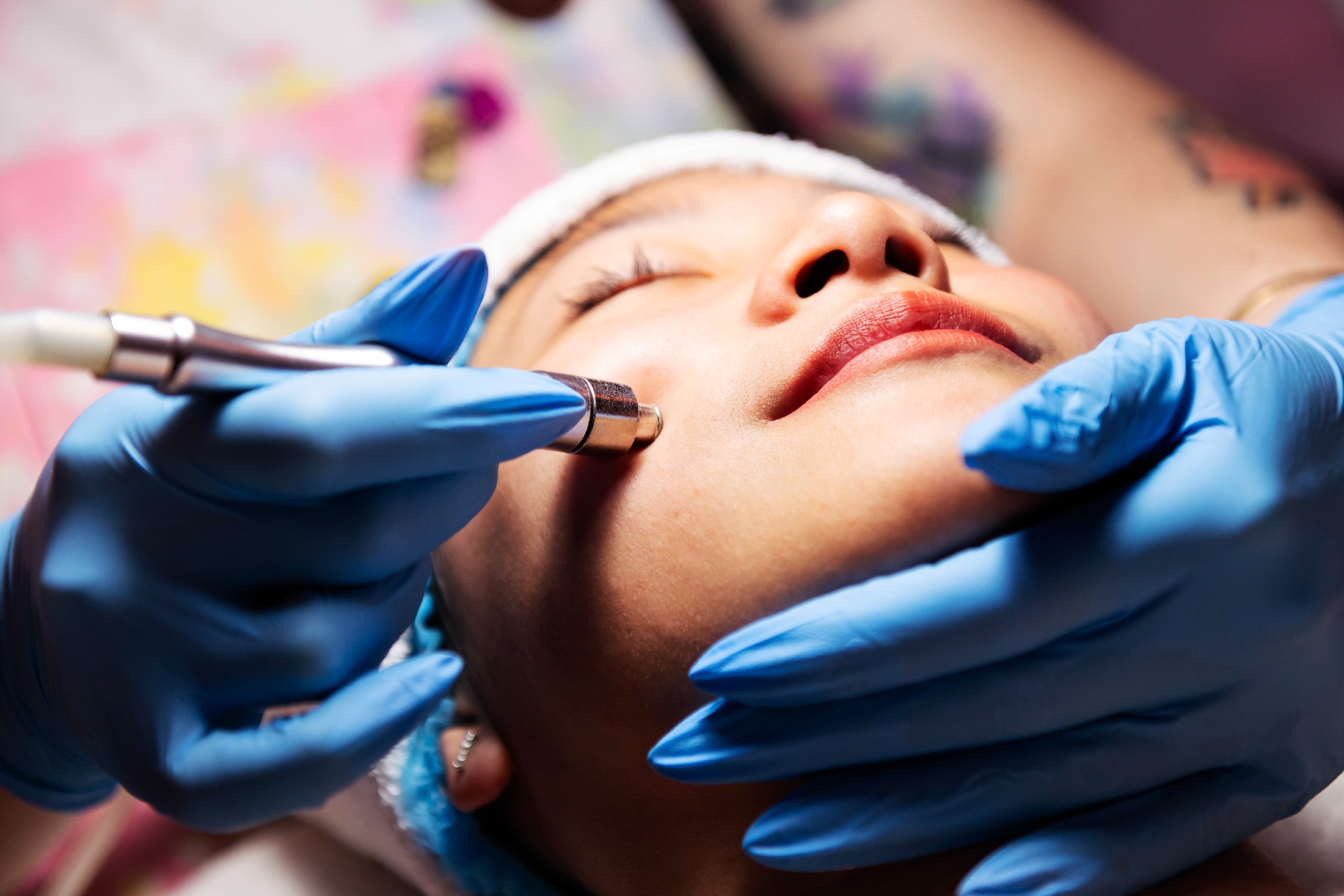 Woman Receiving An Exfoliating Facial Treatment
