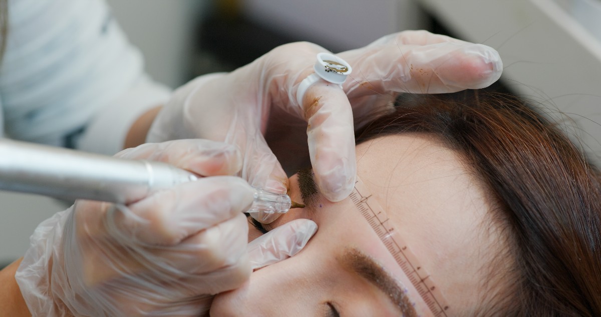 Woman Undergo Micro Pigmentation Eyebrows In A Beauty Salon